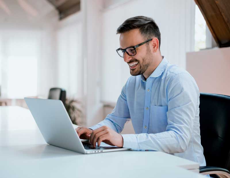 man working on a laptop learning millinpro